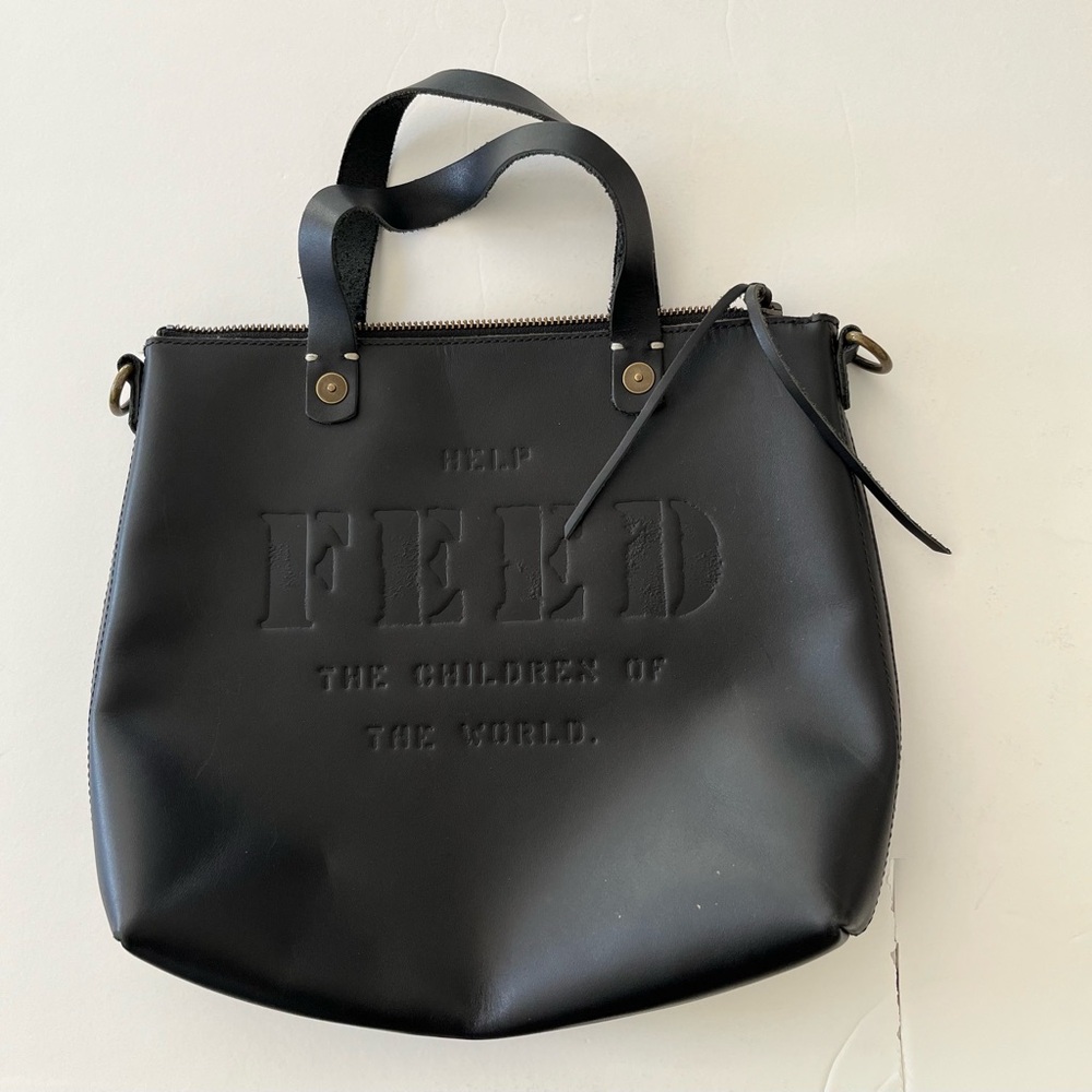 LEATHER FEED THE CHILDREN BAG